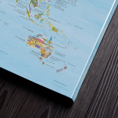 Bottom right corner of the Running Map canvas of the world lying flat on a table