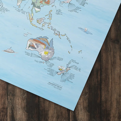 Bottom right corner of the Snowtrip Map poster of the world lying flat on a table