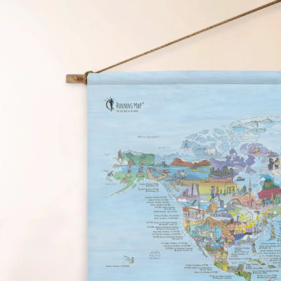 Top left corner of the Golf Map roll down canvas of the world hanging on a wall