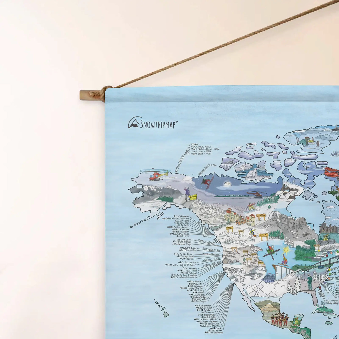 Top left corner of the Snowtrip Map roll down canvas of the world hanging on a wall