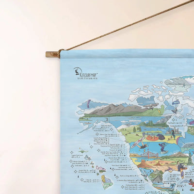 Top left corner of the Kitesurf Map roll down canvas of the world hanging on a wall.