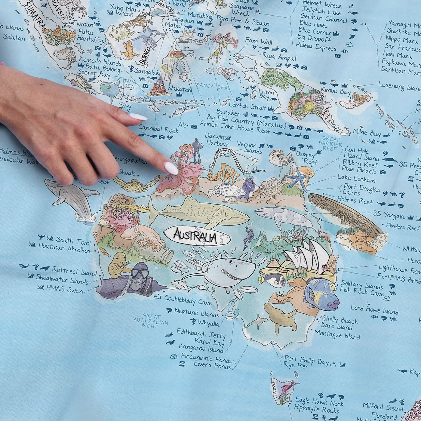 Close-up of the Dive Map towel highlighting icons on dive types and marine life