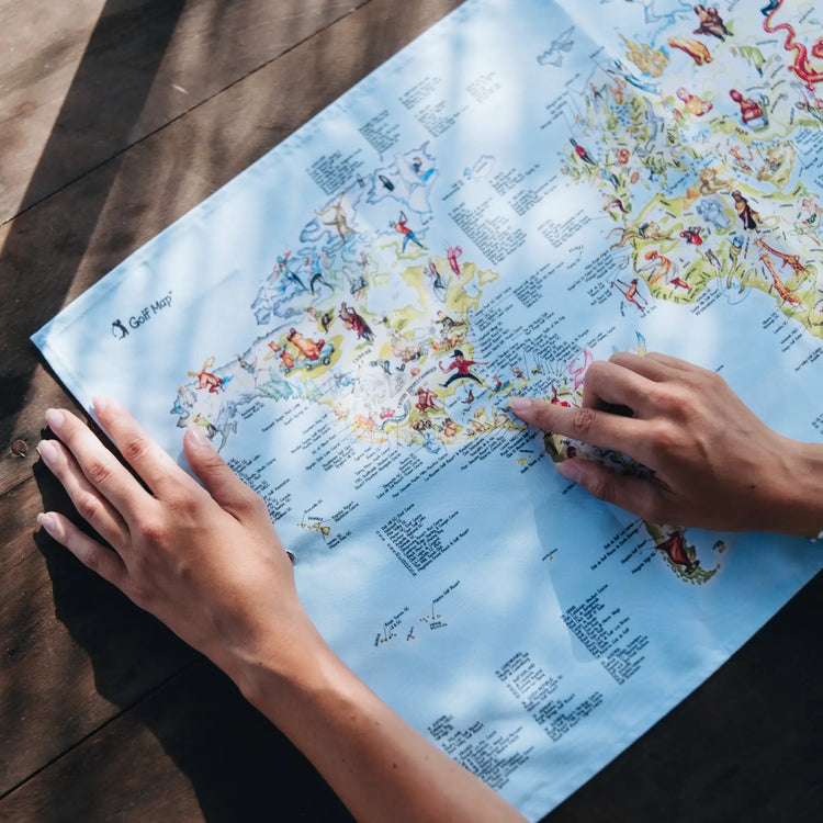 Image of Golf Club towel with womn hands pointing on world map print